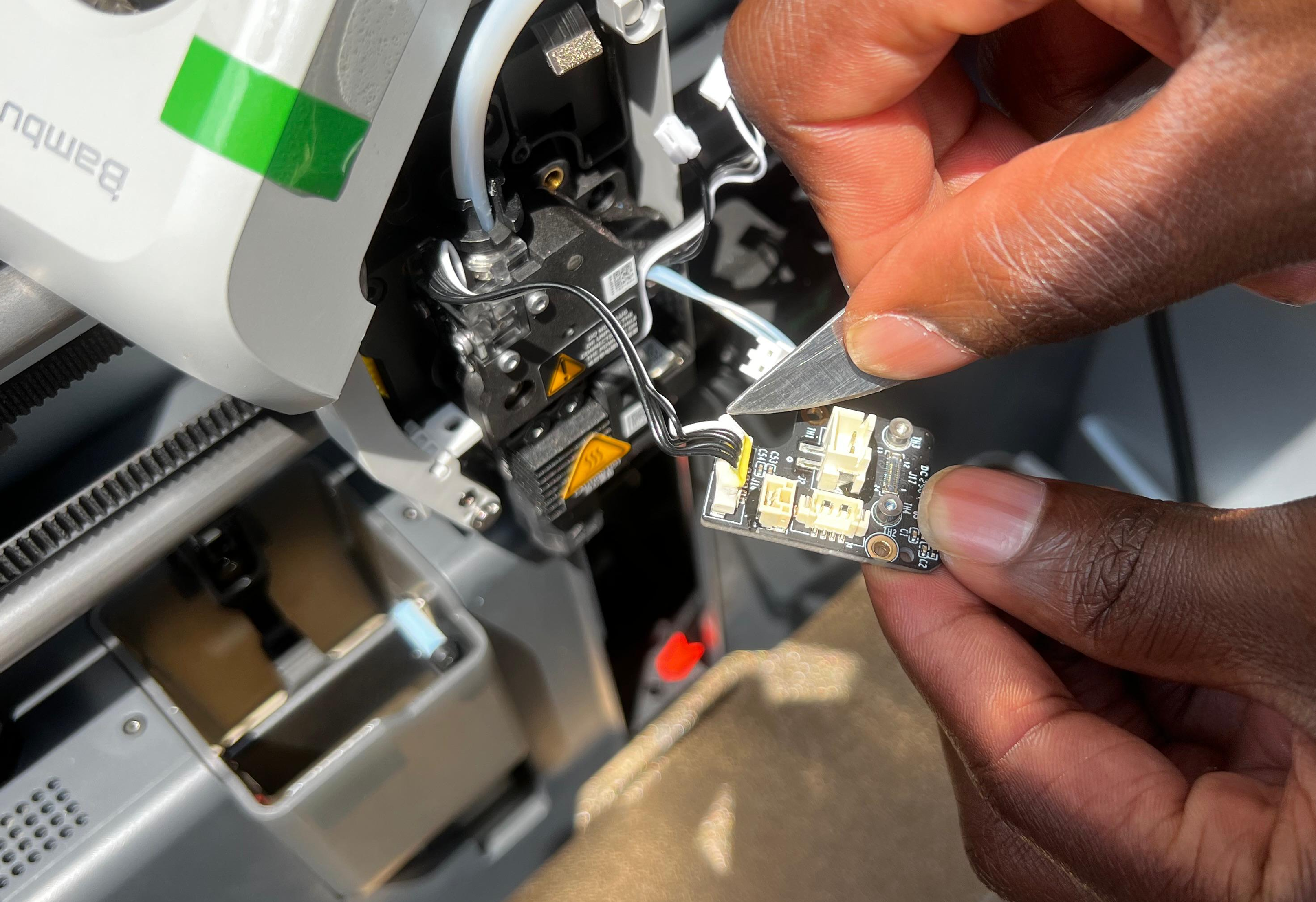 removing-silicon-glue-around-the-cable-connector.png